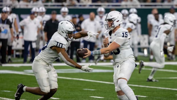 Penn State quarterback Drew Allar hands off to Kaytron Allen against Michigan State.